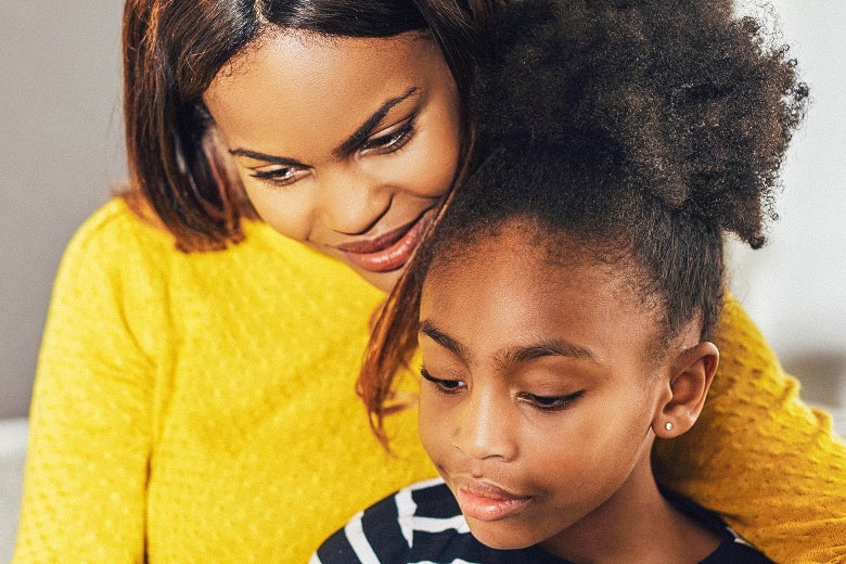 A black mother embracing her daughter.